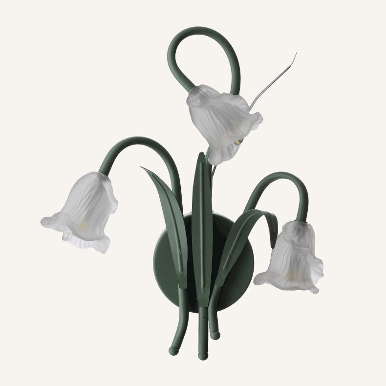 FloralGlow – Vägglampa med blommönster i glas och järn