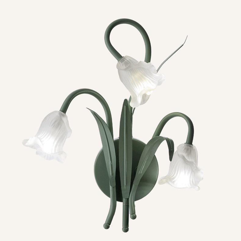 FloralGlow – Vägglampa med blommönster i glas och järn
